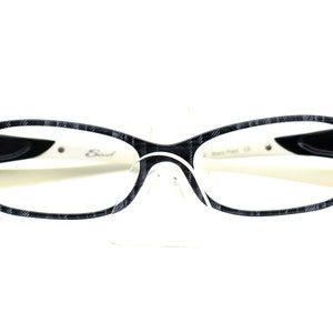 May include: Black and white patterned eyeglasses with a white frame and black arms. The brand name "Eud" is visible on the right arm.
