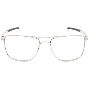 May include: Silver-toned rectangular eyeglasses with a thin metal frame and clear lenses.