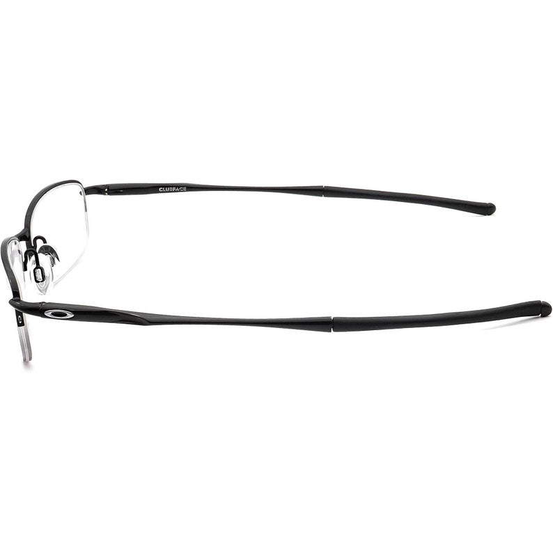 May include: Black metal frame eyeglasses with clear lenses. The arms of the glasses are labelled "CLIFSPACE".