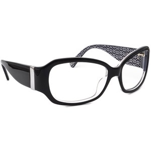 May include: Black rectangular eyeglasses with clear lenses and a black and white patterned design on the arms.
