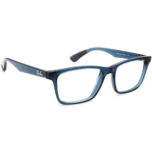 May include: Blue Ray-Ban eyeglasses with a rectangular frame. The temples are a lighter blue with a textured grip near the ear. The Ray-Ban logo is visible on the left temple. The frame is a translucent blue.