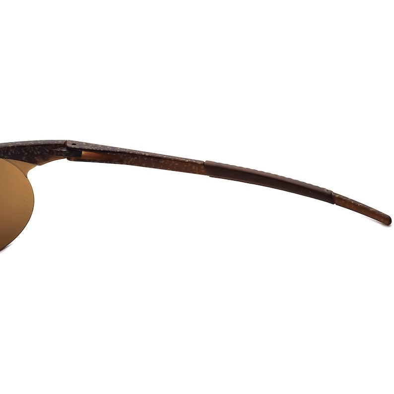 May include: A pair of brown sunglasses with a flexible frame and brown lenses.