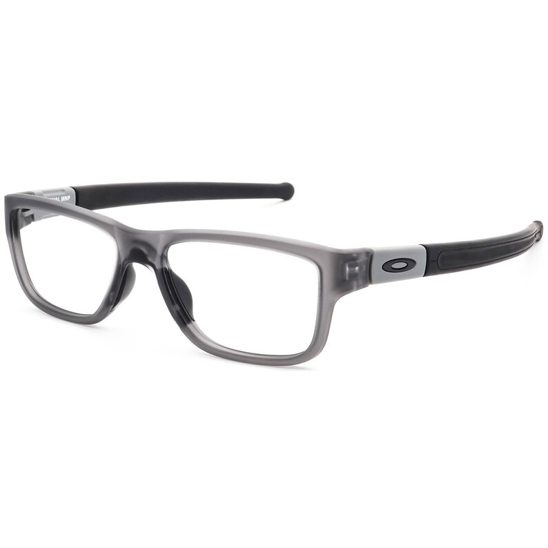 May include: Grey semi-rimless spectacles with black arms and a grey lens. The brand name "Oakley" is visible on the arm.