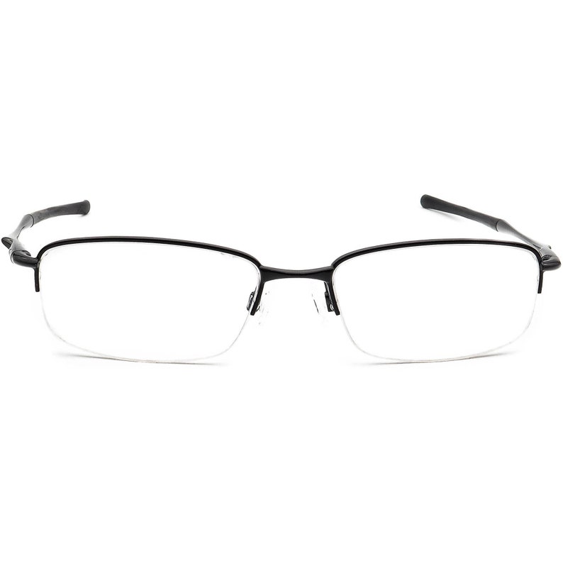 May include: Black half-rim spectacles with a thin metal frame.