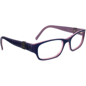 May include: Purple and blue plastic eyeglasses with a rectangular frame. The glasses have a subtle gradient effect and the brand name "FENDI" is printed on the side.