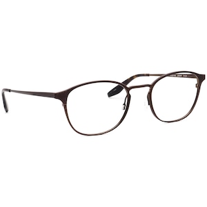 May include: Round-framed spectacles with a dark brown metal frame. The clear lenses are set within the frame, and the thin temples extend to the sides. The glasses are designed for vision correction.