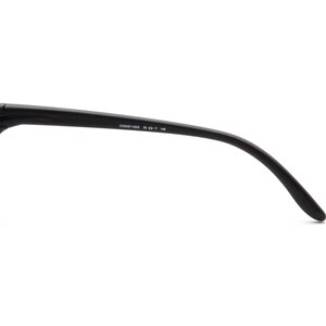May include: Black sunglasses arm with the text "OO9357-0555 55 17 145". The arm curves downward and has a matte finish. The sunglasses appear to be made of a durable material.
