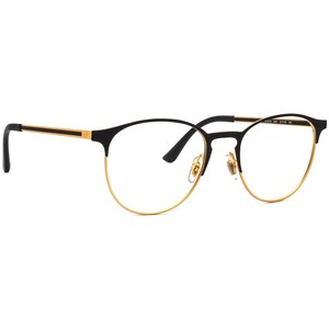 Peut inclure: Lunettes rondes avec monture noire et dorée. La partie supérieure et les branches sont noires, avec des détails dorés sur les branches et la moitié inférieure de la monture. Taille de la monture : 51x18 145.