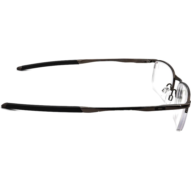 May include: A pair of black metal frame eyeglasses with clear lenses. The glasses have a thin, sleek design and are suitable for everyday wear.