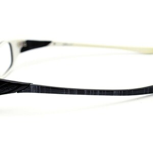 May include: White and black patterned eyeglasses with a white frame and black temples.