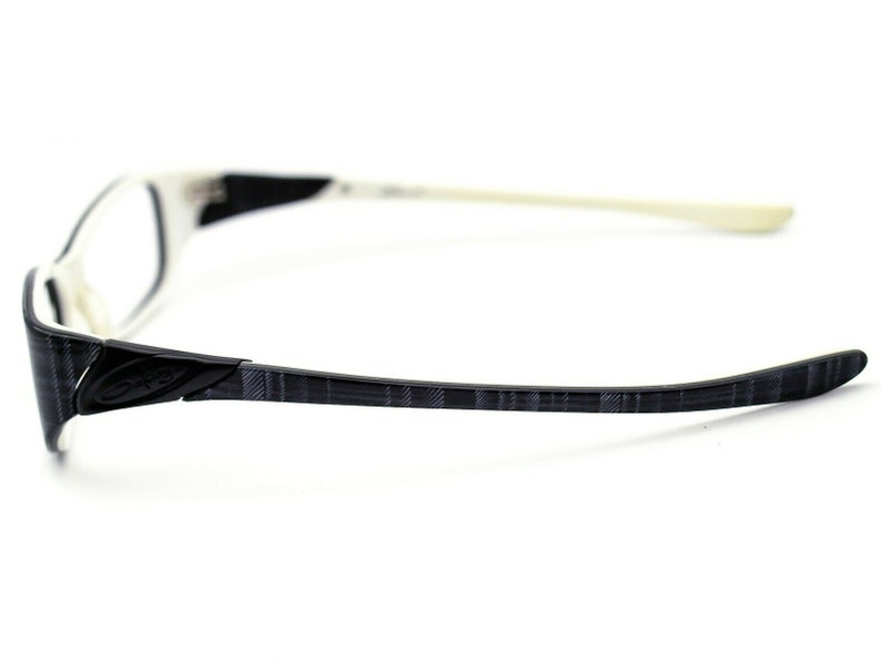 May include: White and black patterned eyeglasses with a white frame and black temples.