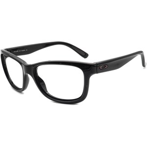 Op de afbeelding: Zwarte rechthoekige bril van plastic met heldere glazen. De merknaam "Oakley" is zichtbaar aan de zijkant van het montuur.