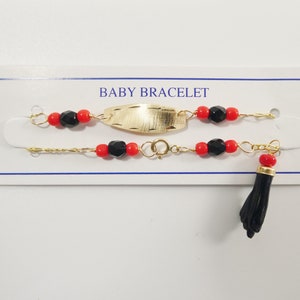 Gold baby bracelet with black fist best sale