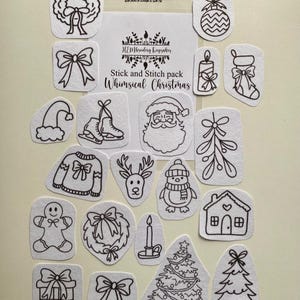 May include: A selection of white felt Christmas-themed stick and stitch patches with black outlines. Designs include a wreath, bow, Santa, Christmas tree, and other festive elements. The text "Stick and Stitch pack Whimsical Christmas" is visible.