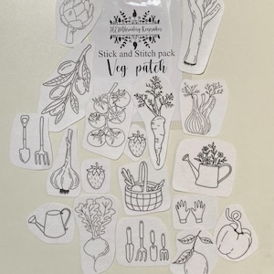 May include: A selection of white fabric patches with black line drawings of vegetables, gardening tools, and a watering can. The patches include images of a carrot, tomato, strawberry, and a lemon. The text "Stick and Stitch pack Veg patch" is visible.