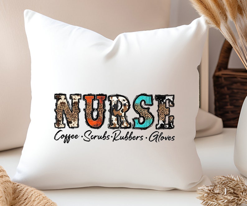 May include: White throw pillow with the word "NURSE" in colorful patterned letters. The letters are decorated with animal print designs. The text "Coffee Scrubs Rubbers Gloves" is written below the word "NURSE".