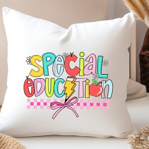 May include: White pillow with a colorful graphic that says "Special Education" with a pencil, apple, and flowers.