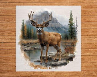 May include: A watercolor painting of a white-tailed deer standing in a stream with a mountain in the background.
