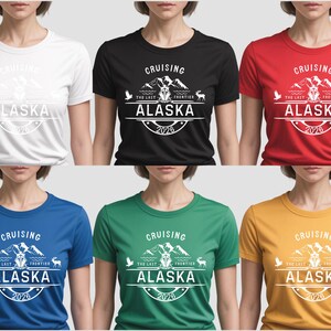 The image is a collage of six t-shirt designs featuring the text "Cruising Alaska" in various colors and styles.