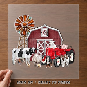 May include: A transparent transfer sheet featuring a watercolor illustration of a red barn, a rusty windmill, a red tractor, a black and white cow, a sheep, a lamb, a pig, a dog, a rooster, two chicks, and two goats with the text IRON ON READY TO PRESS.