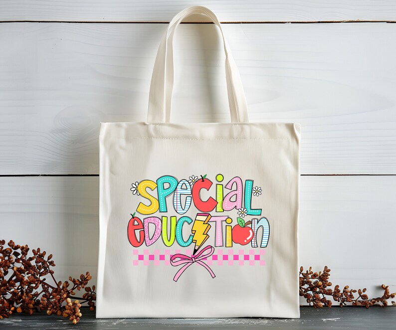 May include: A white canvas tote bag with a colorful graphic that says "Special Education" with a pencil, apple, and flowers.