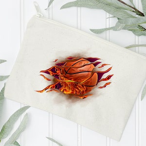 May include: A white canvas zippered pouch with a basketball on fire graphic. The basketball is orange and brown with black lines. The flames are orange and yellow.