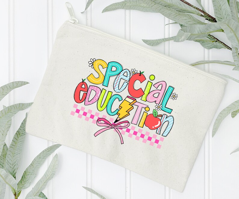 May include: A white canvas zippered pouch with a colorful graphic that says "Special Education" with a pink bow and a red apple.