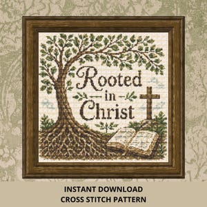 May include: A framed cross stitch pattern featuring a large tree with visible roots, an open book, and a cross. The text "Rooted in Christ" is centered in dark brown lettering. The design uses shades of green, brown, and cream on a grid background.