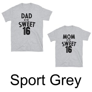 May include: Two grey t-shirts with black text. The first shirt says "Dad of the Sweet 16". The second shirt says "Mom of the Sweet 16".