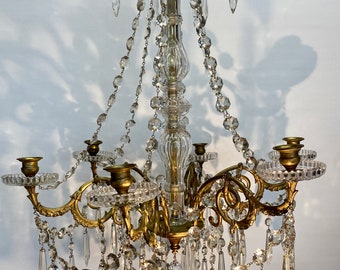 Antique / vintage Candelabra with 6 ornate Brass arms with an abundance of crystal swags & prism drops.