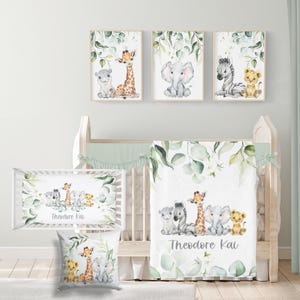 May include: A nursery set with watercolour animal illustrations. The set includes framed prints, a crib sheet, a pillow, and a blanket. The artwork features a giraffe, elephant, zebra, lion, and hippo. The colour scheme is soft with green foliage.