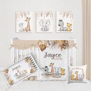 May include: A nursery set featuring a crib, bedding, and wall art with a safari theme. The set includes a crib bumper, blanket, and pillow with watercolor illustrations of a giraffe, elephant, zebra, and lion. The wall art features similar animal illustrations.