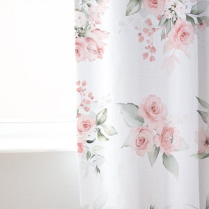 May include: White sheer curtains with a pink floral pattern. The flowers are watercolor style and feature pink roses and green leaves.