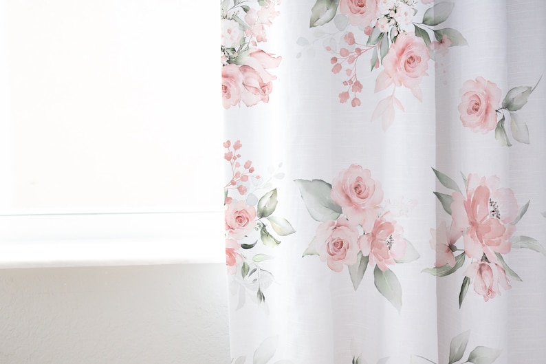May include: White sheer curtains with a pink floral pattern. The flowers are watercolor style and feature pink roses and green leaves.