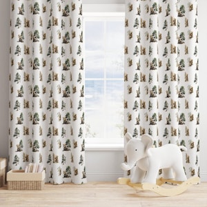 May include: White curtains with a repeating pattern of brown bears and green trees. The curtains are hanging in front of a window. A white elephant rocking toy is in front of the curtains.