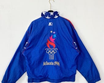 Chaqueta cortavientos vintage de los 90 de los Juegos Olímpicos de Atlanta, EE. UU., marca Starter, logotipo bordado, Juegos Olímpicos de Verano de 1996, color azul, talla M.