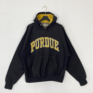 May include: Black hooded sweatshirt with "PURDUE" in gold lettering. The hood lining is gold, and the sweatshirt has a front pocket. The garment is hanging on a metal hanger. A classic collegiate style.