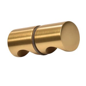 May include: A gold-colored cabinet pull with a cylindrical design. The pull has a smooth, brushed finish and features two curved cutouts on one side. The other side has a flat, circular end. Hardware for home decor.