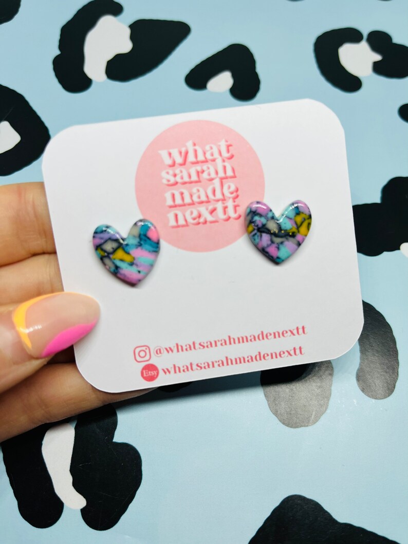Turquoise, mustard, lilac and dusky pink stone polymer clay heart stud earrings on stainless steel butterflies.