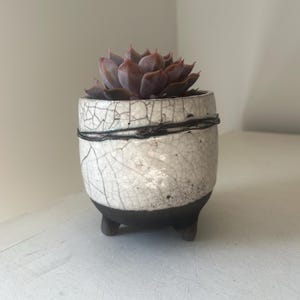 Raku fired white footed planter with copper wire detail. Danish handmade Raku glazed ceramic plant pot. Ideal for a cactus or succulent.