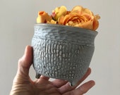 Handmade stoneware ceramic carved footed grey planter pot.