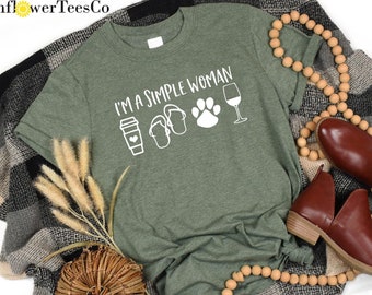 May include: A green t-shirt with the text "I'm a simple woman" and icons of a coffee cup, flip flops, a paw print, and a wine glass.