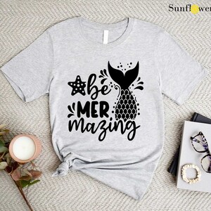 a t - shirt with the words be mermazing printed on it