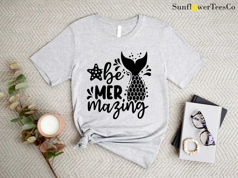 a t - shirt with the words be mermazing printed on it
