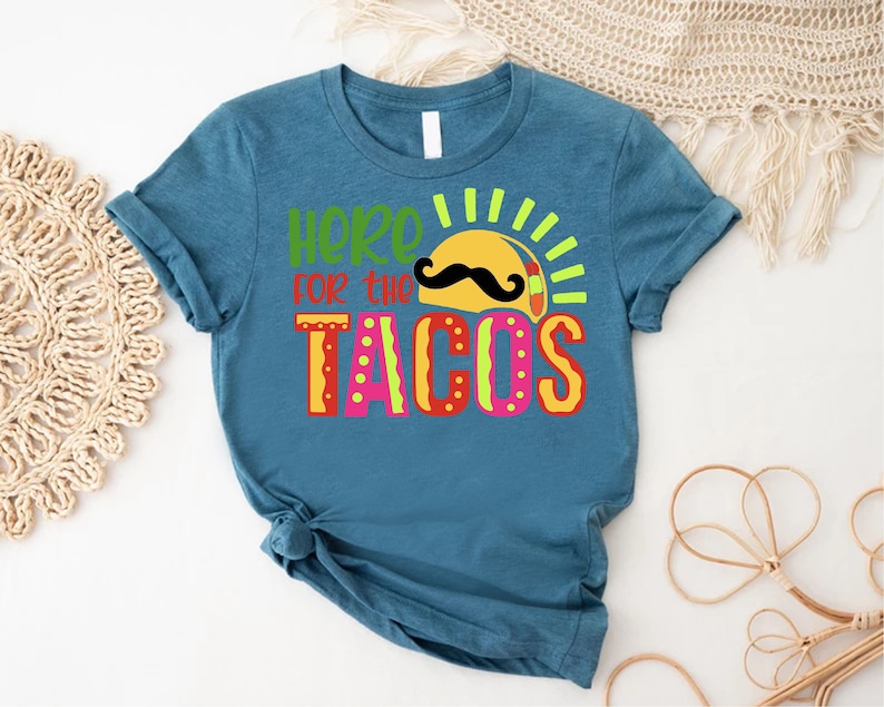 a t - shirt that says here is the tacos