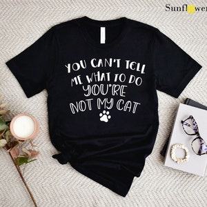 a t - shirt that says you can't tell what to do if you