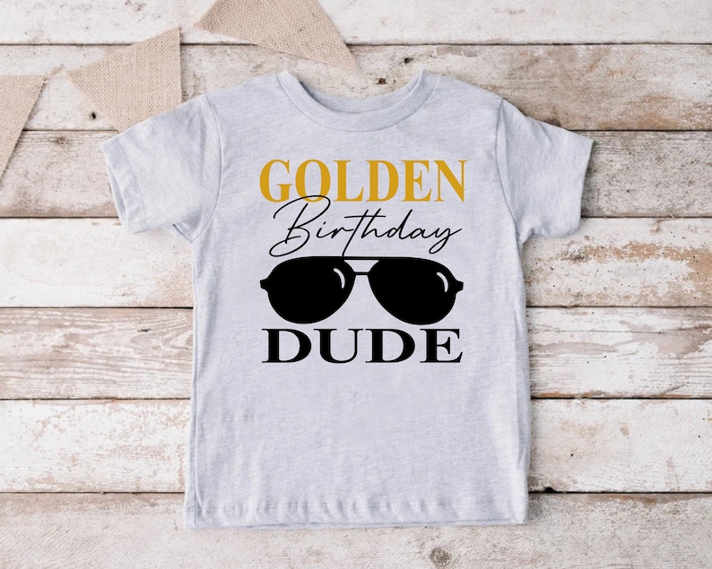 a shirt that says golden birthday dude with sunglasses on it