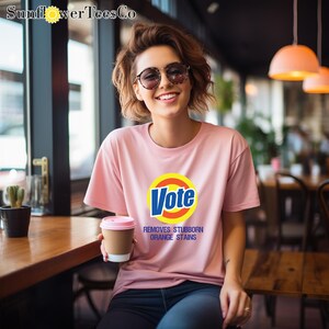 a woman sitting at a table with a cup of coffee
