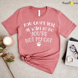a t - shirt that says you can't tell me what to do with