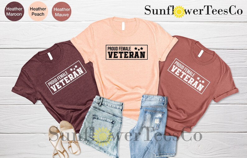 May include: Three t-shirts with the text "PROUD FEMALE VETERAN" in a white rectangle with three stars. The shirts are in maroon, peach, and heather mauve.